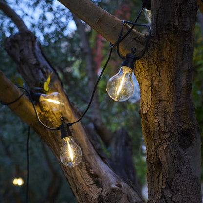 Anschließbare Außenlichtgirlande 10 warmweiße LED-Kugeln transparent PARTY CLEAR HYBRID 7,50m solar- und netzbetrieben